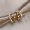 "Buy elegant double-layered faux pearl stud earrings for women in Pakistan – C-shaped chic design with zinc alloy and copper posts"